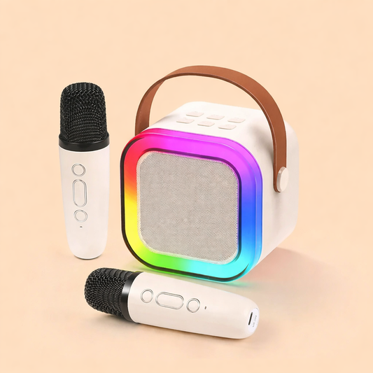 Machine karaoké portable avec haut-parleur Bluetooth LED multicolore et deux microphones sans fil, design compact avec poignée, idéale pour enfants et soirées.