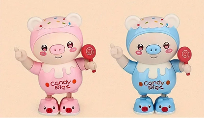 Jouet cochon dansant lumineux rose et bleu avec musique, oreilles éclairées et sucette, présenté sur une scène avec des notes de musique colorées. Jouet interactif éducatif pour bébé et jeune enfant favorisant l'éveil sensoriel et le divertissement.