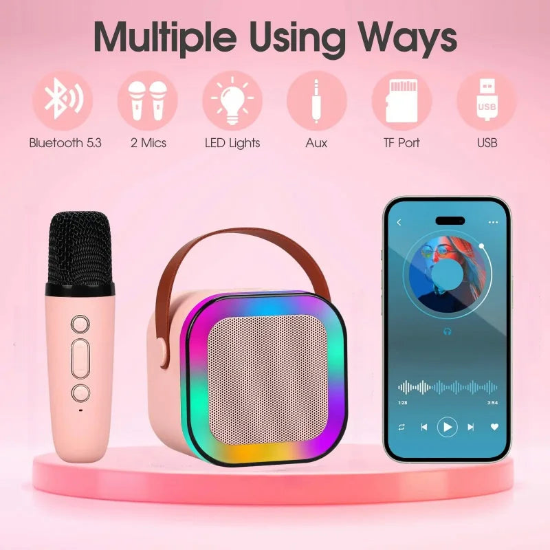 Machine karaoké portable avec haut-parleur Bluetooth LED multicolore et deux microphones sans fil, design compact avec poignée, idéale pour enfants et soirées.