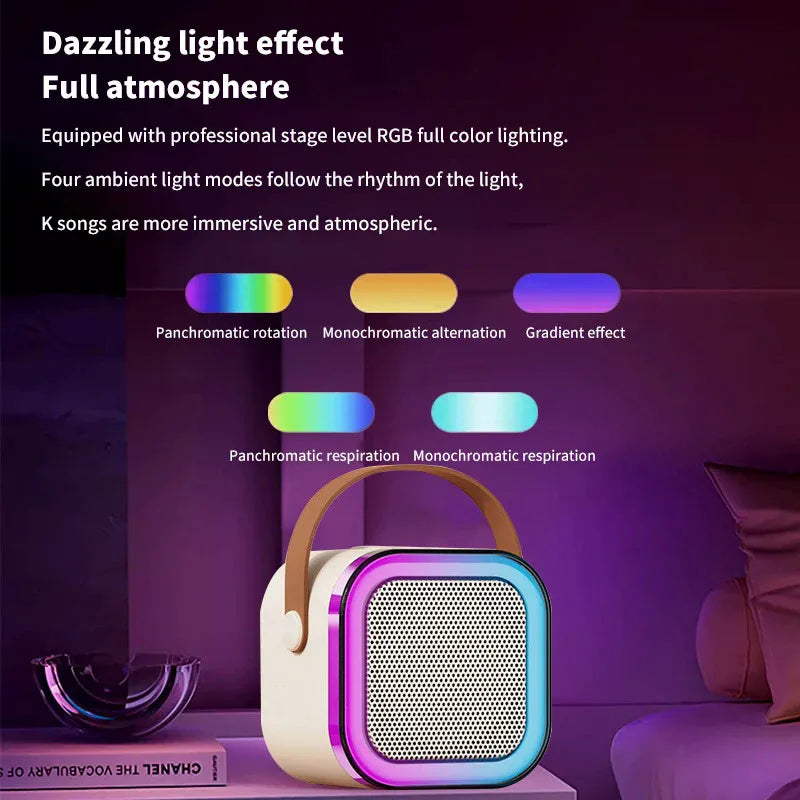 Machine karaoké portable avec haut-parleur Bluetooth LED multicolore et deux microphones sans fil, design compact avec poignée, idéale pour enfants et soirées.